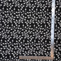 Sheer black cotton with white embroidered vine pattern